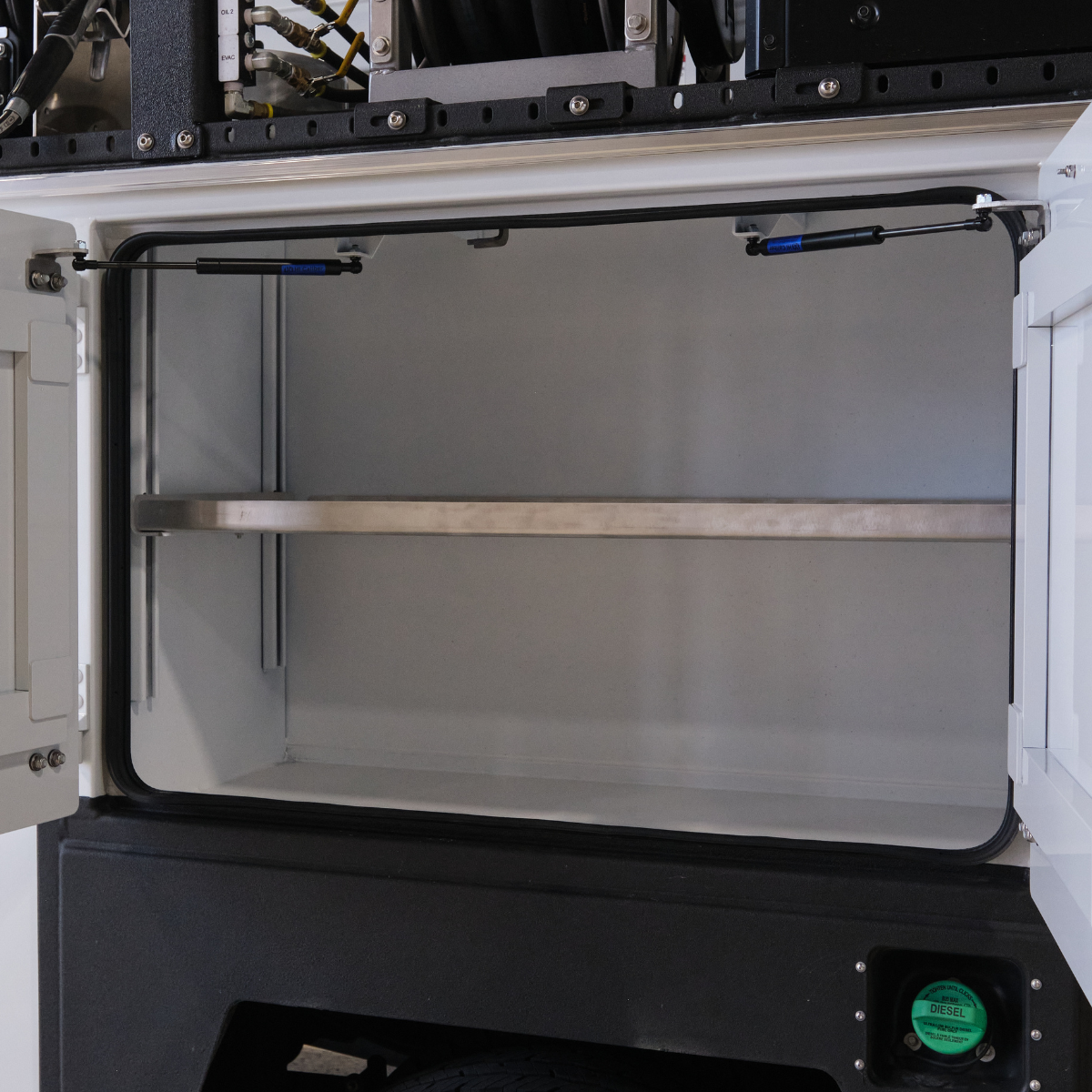 Open service body compartment with hansen international gas spring installation